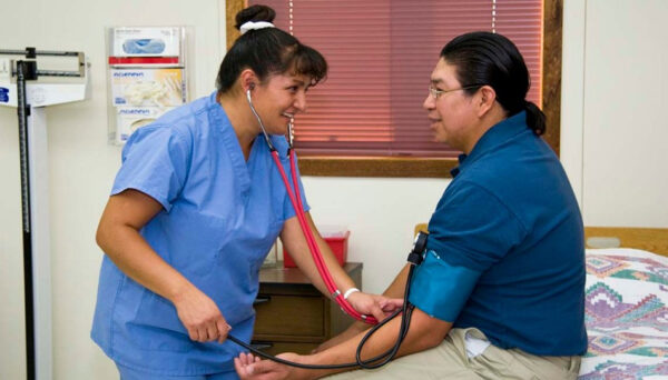 an image of a nurse treating a patient in a hospital